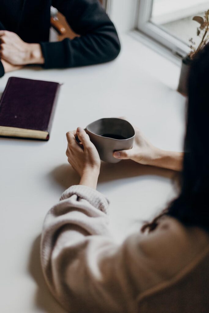 A psychic reading in progress with a person receiving insights from a psychic, creating a calm and spiritual atmosphere.